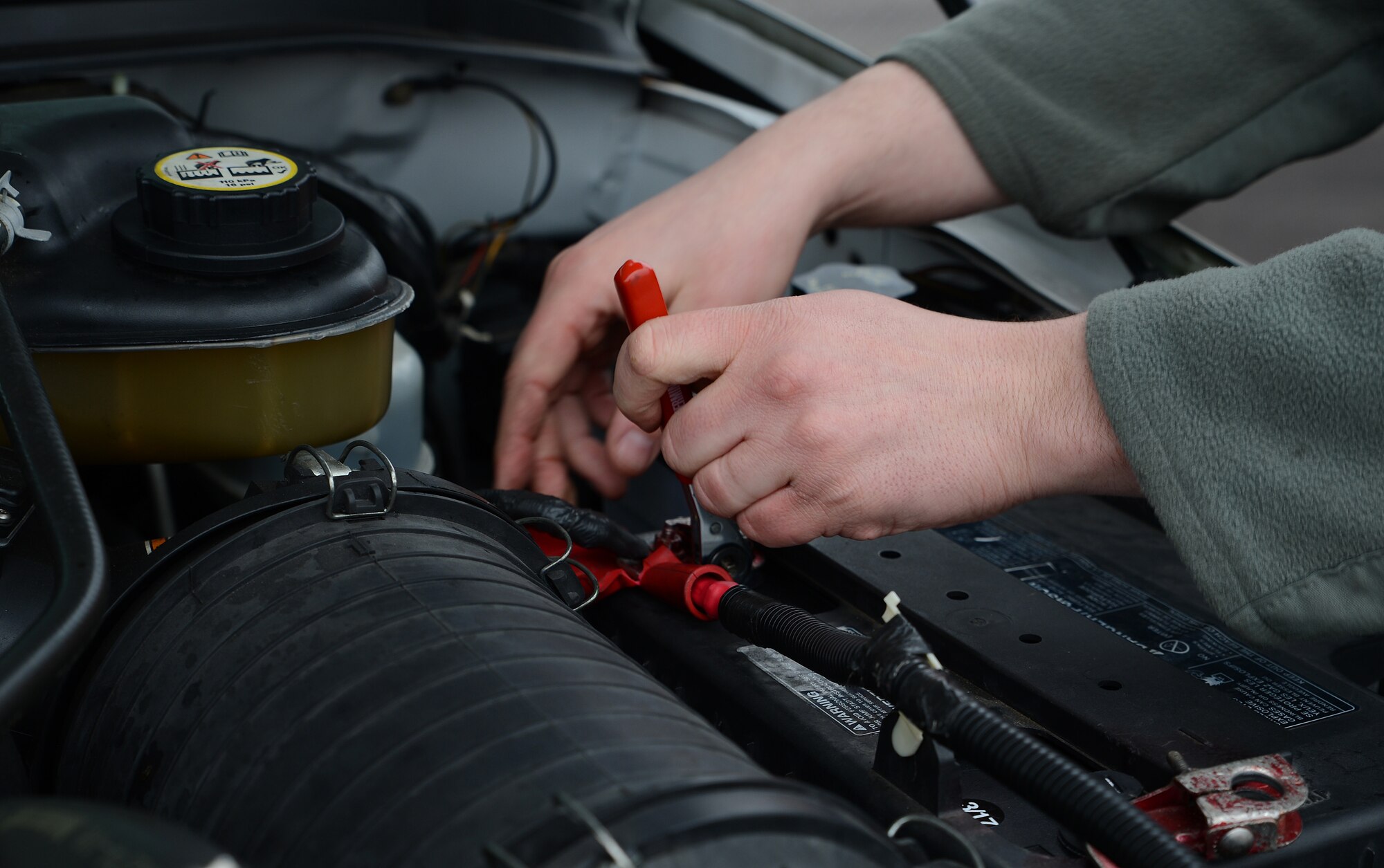 Staff Sgt. William Smith, 627th Logistics Readiness Squadron vehicle maintenance technician, loosens a battery cable from a truck battery March 30, 2017, at Joint Base Lewis-McChord, Wash. Vehicle maintenance technicians inspect, troubleshoot and repair vehicles. (U.S. Air Force photo/Senior Airman Jacob Jimenez)