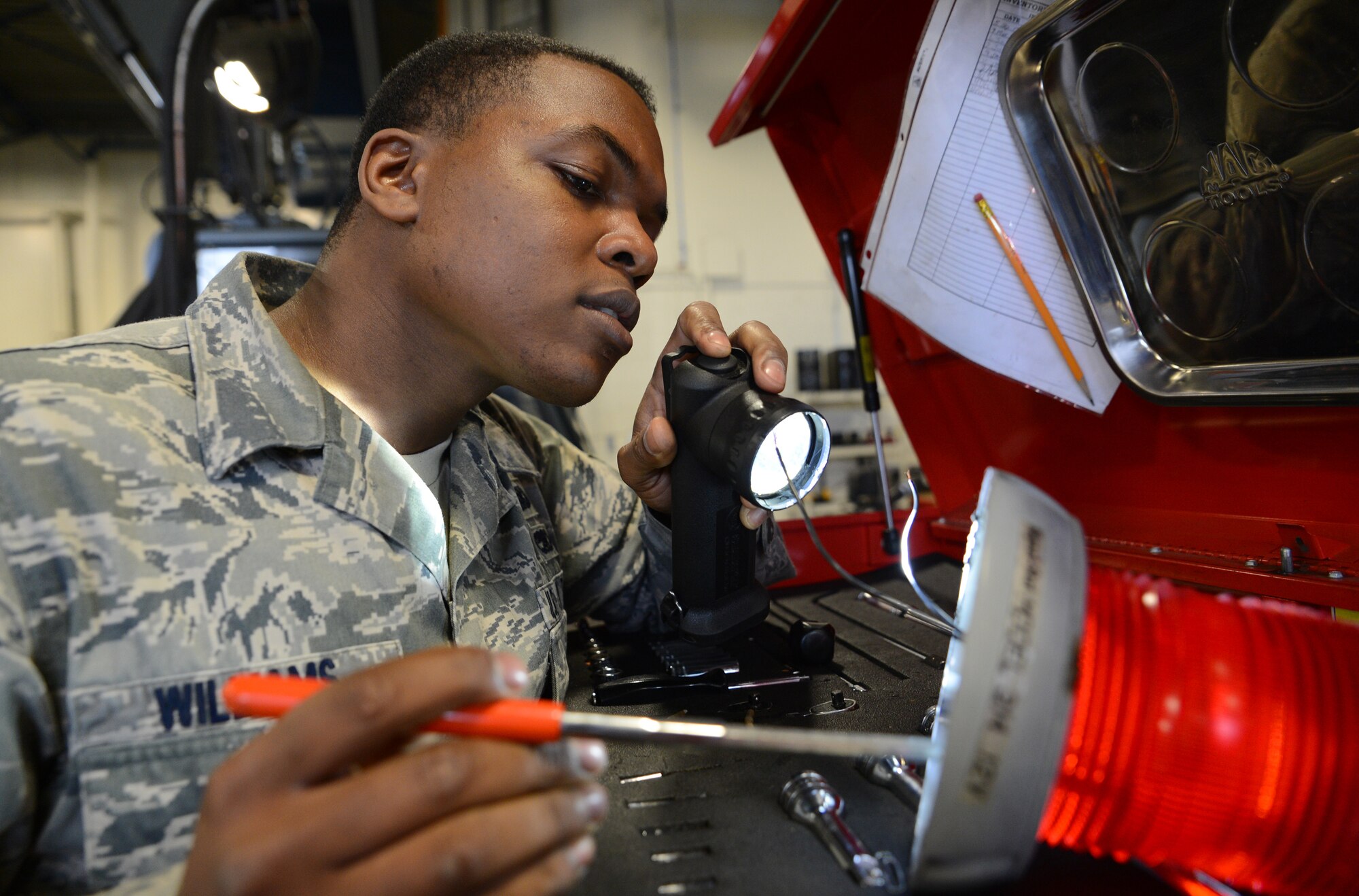 Staff Sgt. Austin Williams, 627th logistics Readiness Squadron vehicle maintenance technician, inspects a strobe light for a deicer March 30, 2017 at Joint Base Lewis-McChord, Wash. Vehicle maintenance technicians are responsible for maintaining all government vehicles assigned to McChord Field. (U.S. Air Force photo/Senior Airman Jacob Jimenez) 