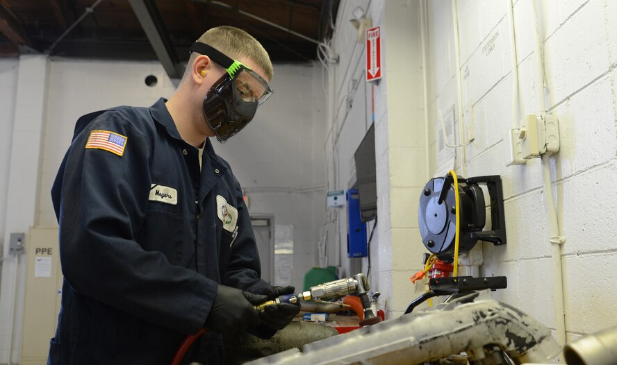 Senior Airman Aaron Myers, 627th Logistics Readiness Squadron vehicle maintenance technician, cleans an intake manifold for a refrigerated truck March 30, 2017, at Joint Base Lewis-McChord, Wash. McChord vehicle maintenance technicians are responsible for performing scheduled maintenance on 15 to 20 vehicles monthly. (U.S. Air Force photo/Senior Airman Jacob Jimenez)   