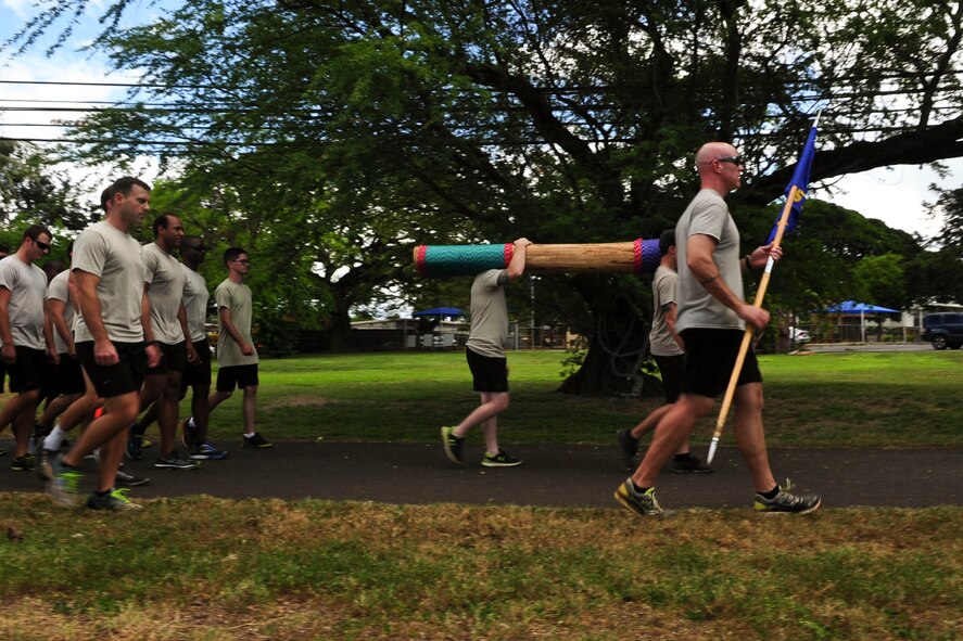 Volunteers jog on the running path overlooking Pearl Harbor during the 6th Annual Tactical Air Control Party (TACP) Association’s Remembrance Run on Joint Base Pearl Harbor-Hickam, Hawaii, March 30, 2017.  Members of the 25th Air Support Operations Squadron organized and participated in a 24-hour run challenge.  The TACP Association seeks to “remember the fallen, honor the living, and aid brothers in need,” by providing support to TACPs who were wounded and assisting the families of those killed in action.  The event is held world-wide, with every TACP unit starting the run at noon local time.  (U.S. Air Force photo by Tech. Sgt. Heather Redman)