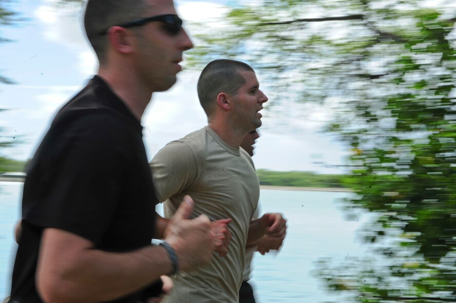 Volunteers jog on the running path overlooking Pearl Harbor during the 6th Annual Tactical Air Control Party (TACP) Association’s Remembrance Run on Joint Base Pearl Harbor-Hickam, Hawaii, March 30, 2017.  Members of the 25th Air Support Operations Squadron organized and participated in a 24-hour run challenge.  The TACP Association seeks to “remember the fallen, honor the living, and aid brothers in need,” by providing support to TACPs who were wounded and assisting the families of those killed in action.  The event is held world-wide, with every TACP unit starting the run at noon local time.  (U.S. Air Force photo by Tech. Sgt. Heather Redman)