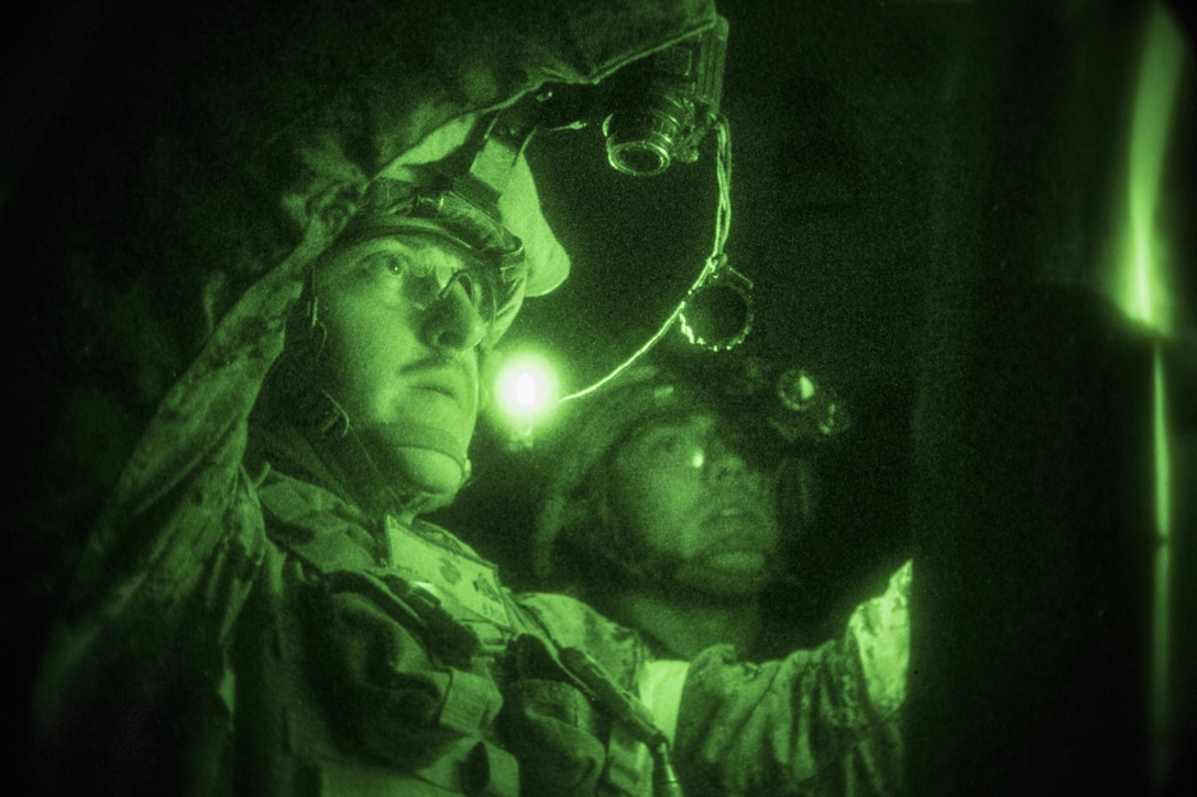 Marines put up new targets during a live-fire range at night at Moron Air Base, Spain, March 24, 2017. The Marines are assigned to Special Purpose Marine Air Ground Task Force-Crisis Response Africa. This was the first time Marines conducted a live-fire event at night, helping them to remain proficient in their marksmanship skills to enhance their quick-response capability. Marine Corps photo by Sgt. Jessika Braden