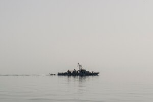 Coastal Patrol Craft USS Thunderbolt (PC 12) recovers a rigid hull inflatable boat (RHIB) during a trilateral exercise between the U.S., Kuwait and Iraqi armed forces in the Arabian Gulf, March 15, 2017. (U.S. Navy Combat Camera photo by Mass Communication Specialist 2nd Class Corbin J. Shea)