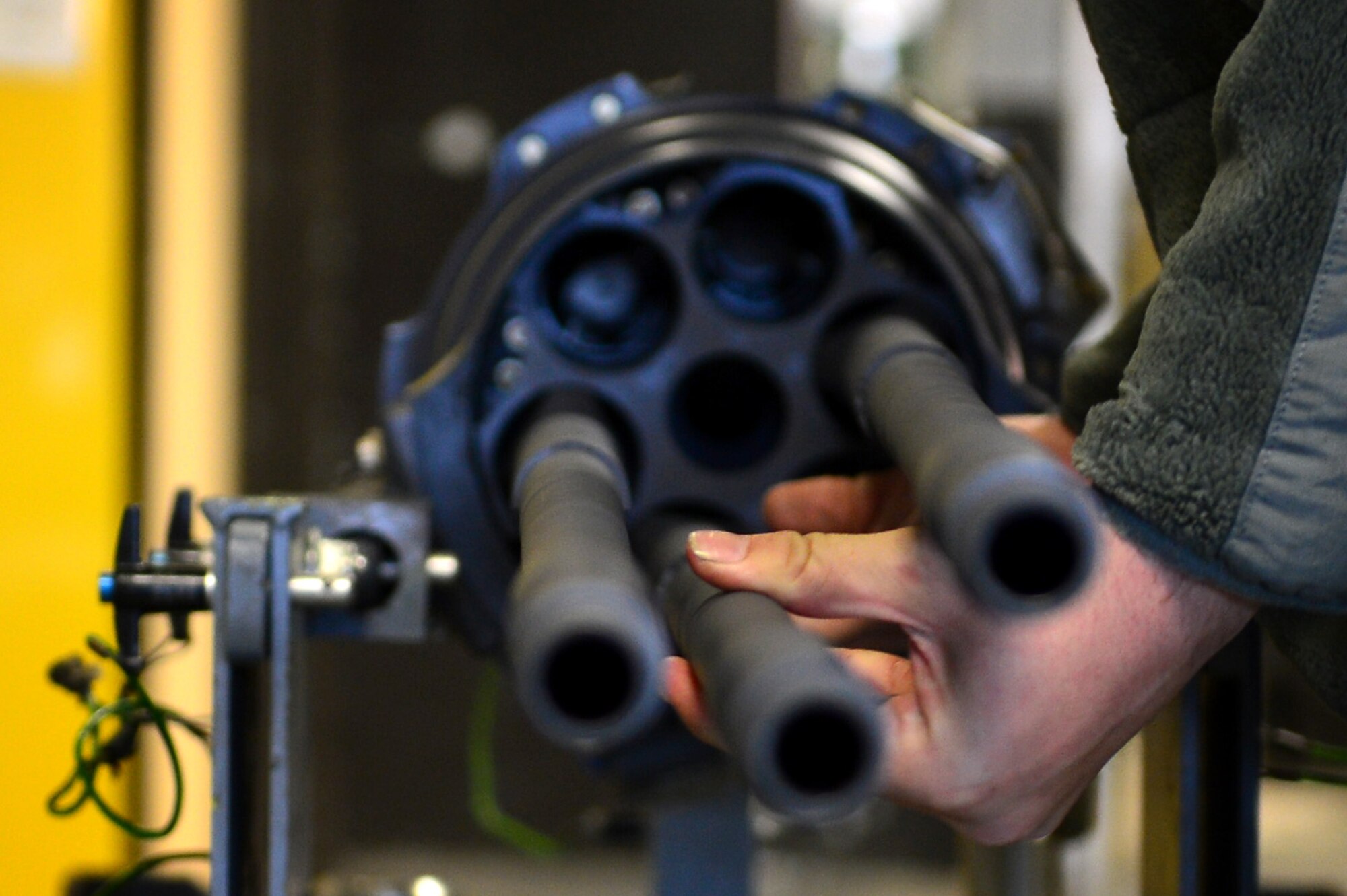 U.S. Air Force Airman Kevin Bates, 20th Equipment Maintenance Squadron aircraft armament systems apprentice, fastens a barrel on an M-61A1 20 mm multi-barrel cannon at Shaw Air Force Base, S.C., March 29, 2017. Airmen assigned to the armaments flight perform maintenance on weaponry to include firing pin testing and operation security checks.  (U.S. Air Force photo by Airman 1st Class Christopher Maldonado)