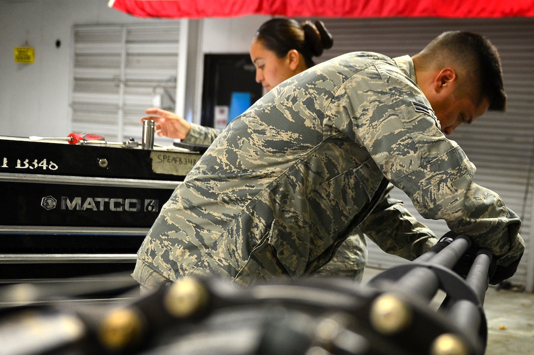 U.S. Air Force Airman 1st Class Zachary Flores, 20th Equipment Maintenance Squadron aircraft armament systems technician, performs an operations security (OPSEC) check on an M-61A1 20 mm multi-barrel cannon at Shaw Air Force Base, S.C., March 29, 2017. Armament flight Airmen ensure all machinery entering the facility is inspected and remains in compliance with all OPSEC measures. (U.S. Air Force photo by Airman 1st Class Christopher Maldonado)