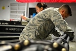U.S. Air Force Airman 1st Class Zachary Flores, 20th Equipment Maintenance Squadron aircraft armament systems technician, performs an operations security (OPSEC) check on an M-61A1 20 mm multi-barrel cannon at Shaw Air Force Base, S.C., March 29, 2017. Armament flight Airmen ensure all machinery entering the facility is inspected and remains in compliance with all OPSEC measures. (U.S. Air Force photo by Airman 1st Class Christopher Maldonado)