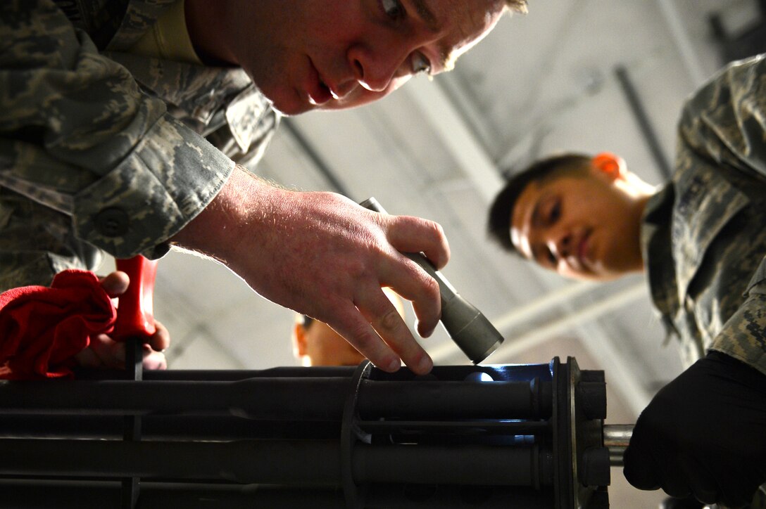 U.S. Air Force Staff Sgt. Jeffrey Dickerson, 20th Equipment Maintenance Squadron aircraft armament systems floor chief, inspects the barrel of an M-61A1 20 mm multi-barrel cannon at Shaw Air Force Base, S.C., March 29, 2017. The armament flight, consisting of approximately 43 Airmen, is tasked with ensuring that all weaponry parts of F-16CM Fighting Falcons are broken down, inspected and put back together. (U.S. Air Force photo by Airman 1st Class Christopher Maldonado)