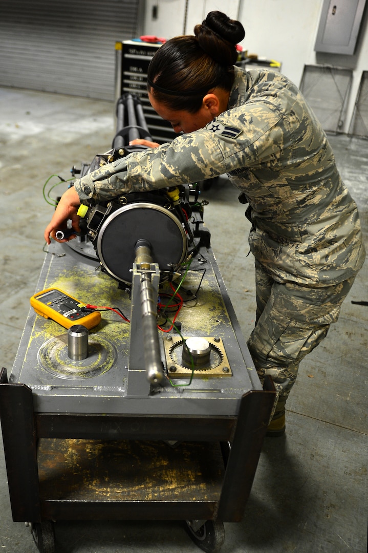 U.S. Air Force Airman 1st Class Jessica Arancibia, 20th Equipment Maintenance Squadron aircraft armament system technician, recalibrates an M-61A1 20 mm multi-barrel cannon at Shaw Air Force Base, S.C., March 29, 2017. The armament flight is tasked with ensuring that weaponry on the F-16CM Fighting Falcon is capable of suppressing enemy air defenses without malfunctions that may cause harm to the pilot or damage the aircraft. (U.S. Air Force photo by Airman 1st Class Christopher Maldonado)