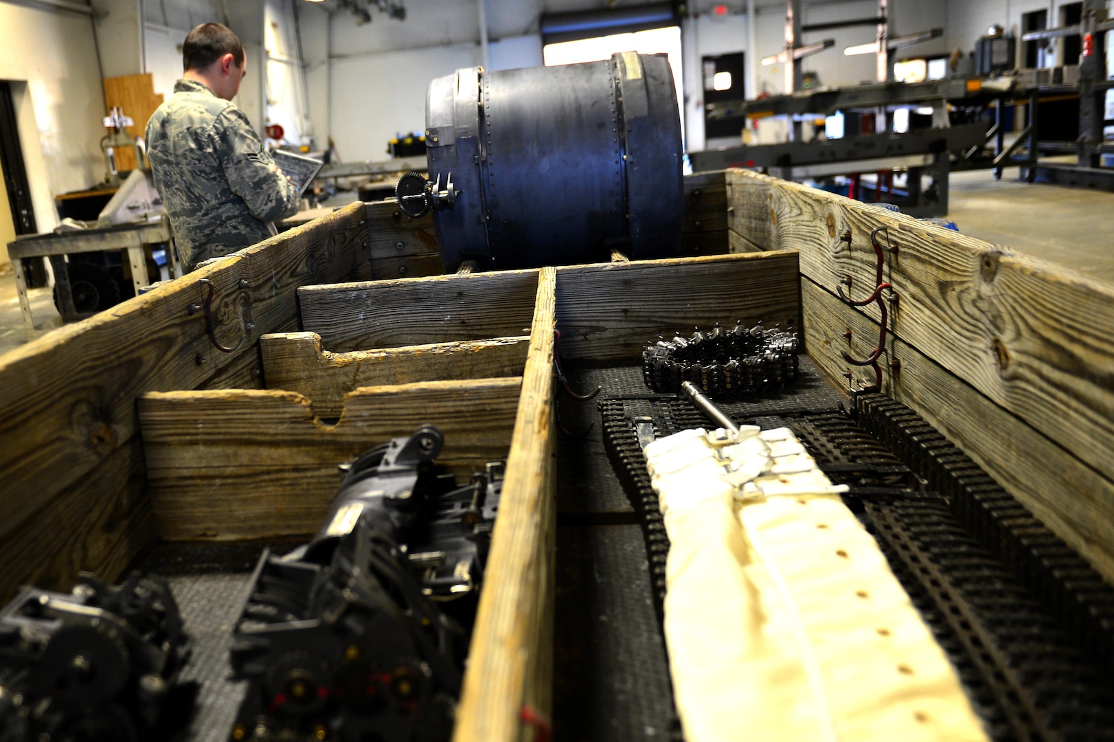 U.S. Air Force Airman 1st Class Spencer Laird, 20th Equipment Maintenance Squadron aircraft armament systems technician, reviews the technical order of an M-61A1 20 mm multi-barrel cannon at Shaw Air Force Base, S.C., March 29, 2017. The armament flight cycles through approximately 1,800 pieces of equipment annually to include F-16CM Fighting Falcon gun and launcher systems. (U.S. Air Force photo by Airman 1st Class Christopher Maldonado)