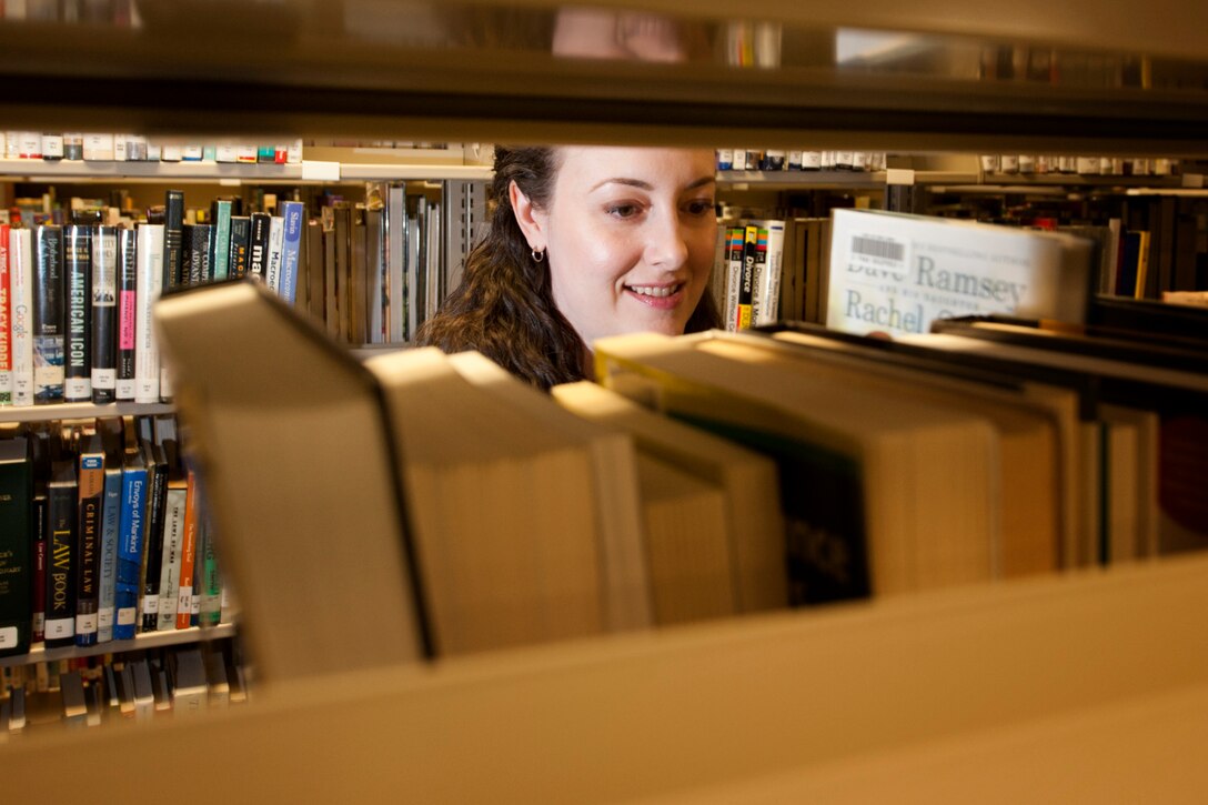 Marsha Adkins, 5th Forces Support Squadron library aide, shelves non-fiction books at Minot Air Force Base, N.D., March 21, 2017. The library is a family-friendly environment, hosting child and adult reading programs throughout the year. (U.S. Air Force photo/Senior Airman J.T. Armstrong)