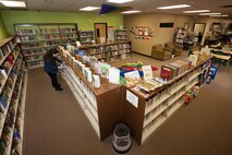 Marsha Adkins, 5th Forces Support Squadron library aide, shelves childrens’ books at Minot Air Force Base, N.D., March 21, 2017. The library is a family-friendly environment featuring a kids section with books, movies, toys and a 3-D printer. (U.S. Air Force photo/Senior Airman J.T. Armstrong)