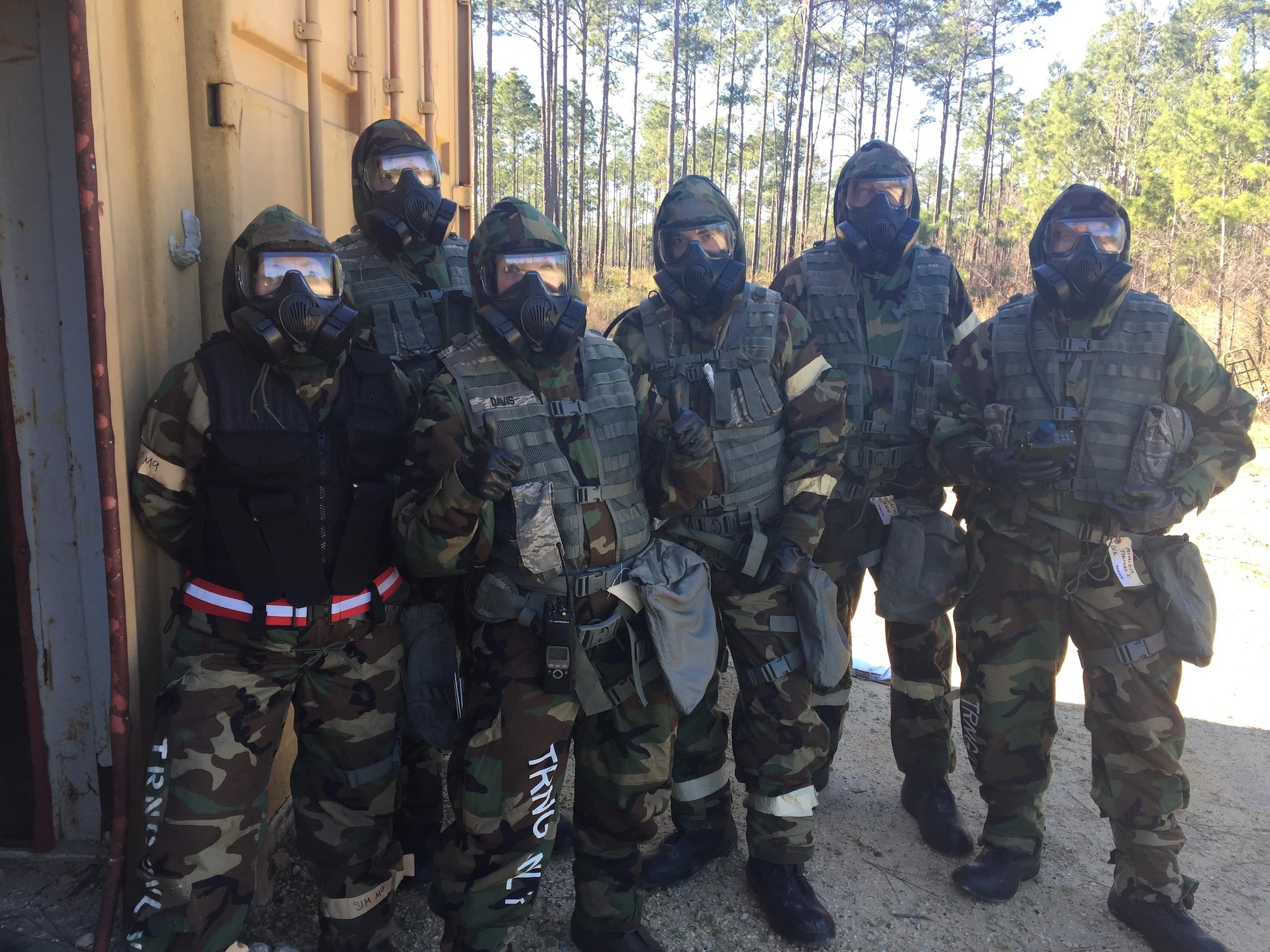 Members of the 911th Civil Engineer Squadron and a member of the 20th Civil Engineer Squadron pose for a group photo after completing a Chemical Biological Radiologic Nuclear reconnaissance and surveillance assignment at Tyndall Air Force Base, Florida, January 24, 2017. The CES membere were at Tyndall AFB attending Silver Flag, a weeklong expeditionary combat support training course. (U.S. Air Force courtesy photo)