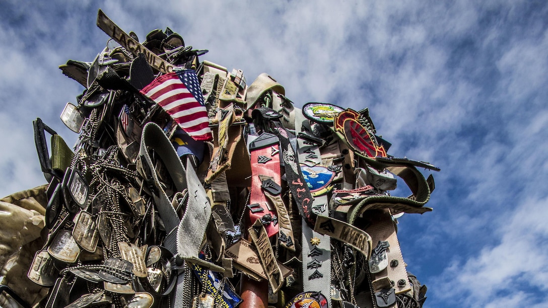 Personal mementos are left to symbolize the respect generations of service members have paid during their visit to the summit of Mount Suribachi, Iwo Jima, Japan, March 25, 2017. Suribachi is where five Marines and a Navy Corpsman famously raised the American flag, signaling the succesful seizure of the northern end of the island.