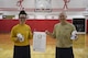 Cmdr. Don Haley, commander of the Navy Operational Support Center Pittsburgh, and Petty Officer 2nd Class Samantha Hamilton, funeral honors director with NOSC Pittsburgh hold a Biggest Loser challenge menu board at the Pittsburgh International Airport Air Reserve Station, March 30, 2017. At each weigh-in during the weight lost competition, the team with the most overall weight loss was given the opportunity to choose a menu item at Perksburgh, the local base café. (U.S. Air Force photo by Senior Airman Beth Kobily) 