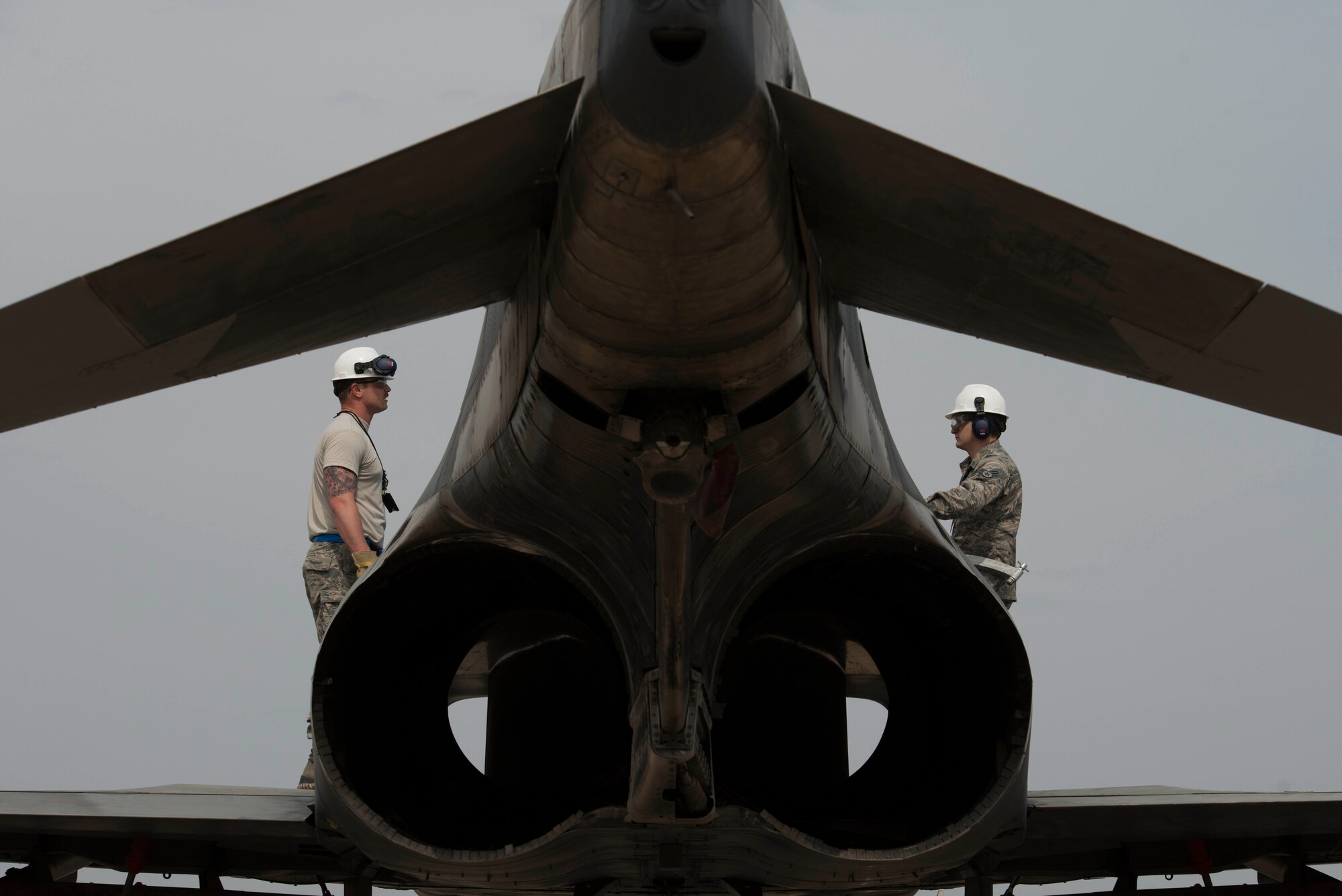 U.S. Air Force Senior Airman Chadon Bowman (left) and Staff Sgt. Corey Nickles, both 39th Maintenance Squadron transient alert, Crash Damaged Disabled Aircraft Recovery (CDDAR) team members, speak to each other while attaching a decommissioned Turkish air force F-4 Phantom to a crane as part of a training exercise March 30, 2017, at Incirlik Air Base, Turkey. The primary objective of the CDDAR mission is to quickly and safely remove immobile aircraft and return the runway to operational status. (U.S. Air Force photo by Airman 1st Class Devin M. Rumbaugh)