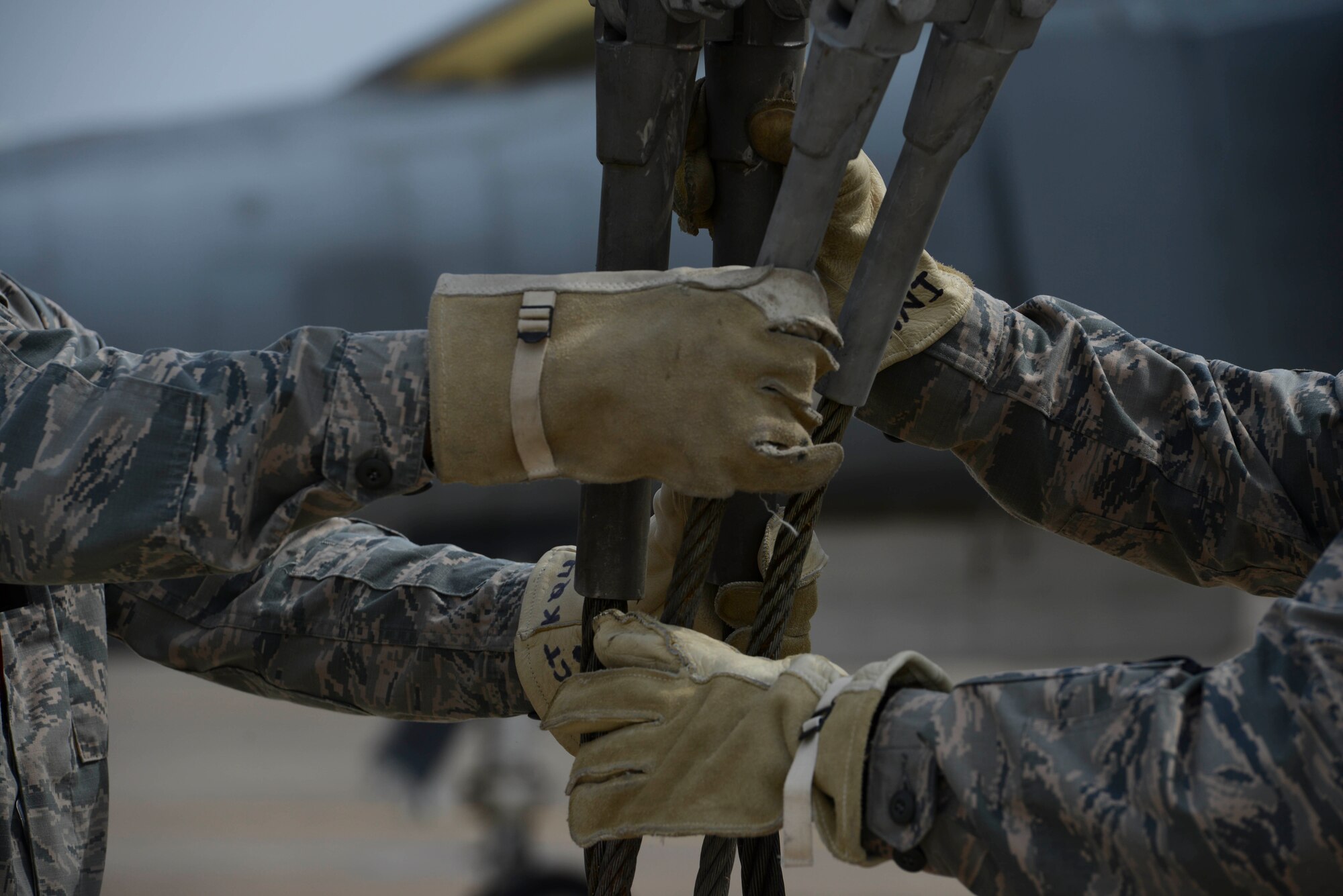U.S. Airmen with the 39th Maintenance Squadron, guide a crane attachment into a box during a Crash Disabled Damaged Aircraft Recovery (CDDAR) training exercise March 30, 2017, at Incirlik Air Base, Turkey. The primary objective of the CDDAR mission is to quickly and safely remove immobile aircraft and return the runway to operational status. (U.S. Air Force photo by Airman 1st Class Devin M. Rumbaugh)