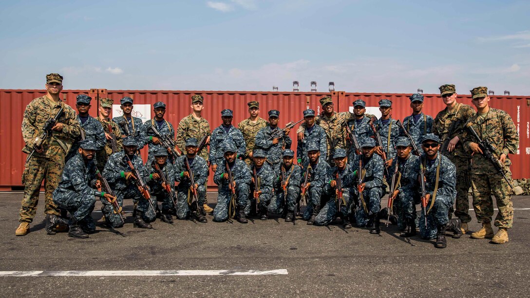U.S. Marines and Sri Lankan Marines pose for a photo during weapons skills familiarization held at the port of Colombo as part of a theater security cooperation engagement, March 28. The engagement will focus on increasing military ties between the U.S. and Sri Lanka, to include: helping shape the development of the newly established Sri Lankan Marine Corps, and increase the Humanitarian Assistance and Disaster Relief capabilities of the Sri Lankan Armed Forces. The Marines are with the 11th Marine Expeditionary Unit.