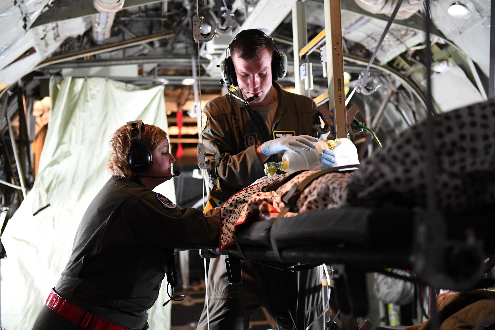 Staff Sgt. Tyler Port, an aeromedical evacuation technician with the 911th Aeromedical Evacuation Squadron, and Tech. Sgt. Brandi Seibel, an aeromedical evacuation technician with the 932nd AES, provide simulated care to a patient at Travis Air Force Base, Calif., March 24, 2017. Port and Seibel were participating in Patriot Delta, a training exercise that brought together AES members from four bases to become better prepared for deployments. (U.S. Air Force photo by Senior Airman Beth Kobily)