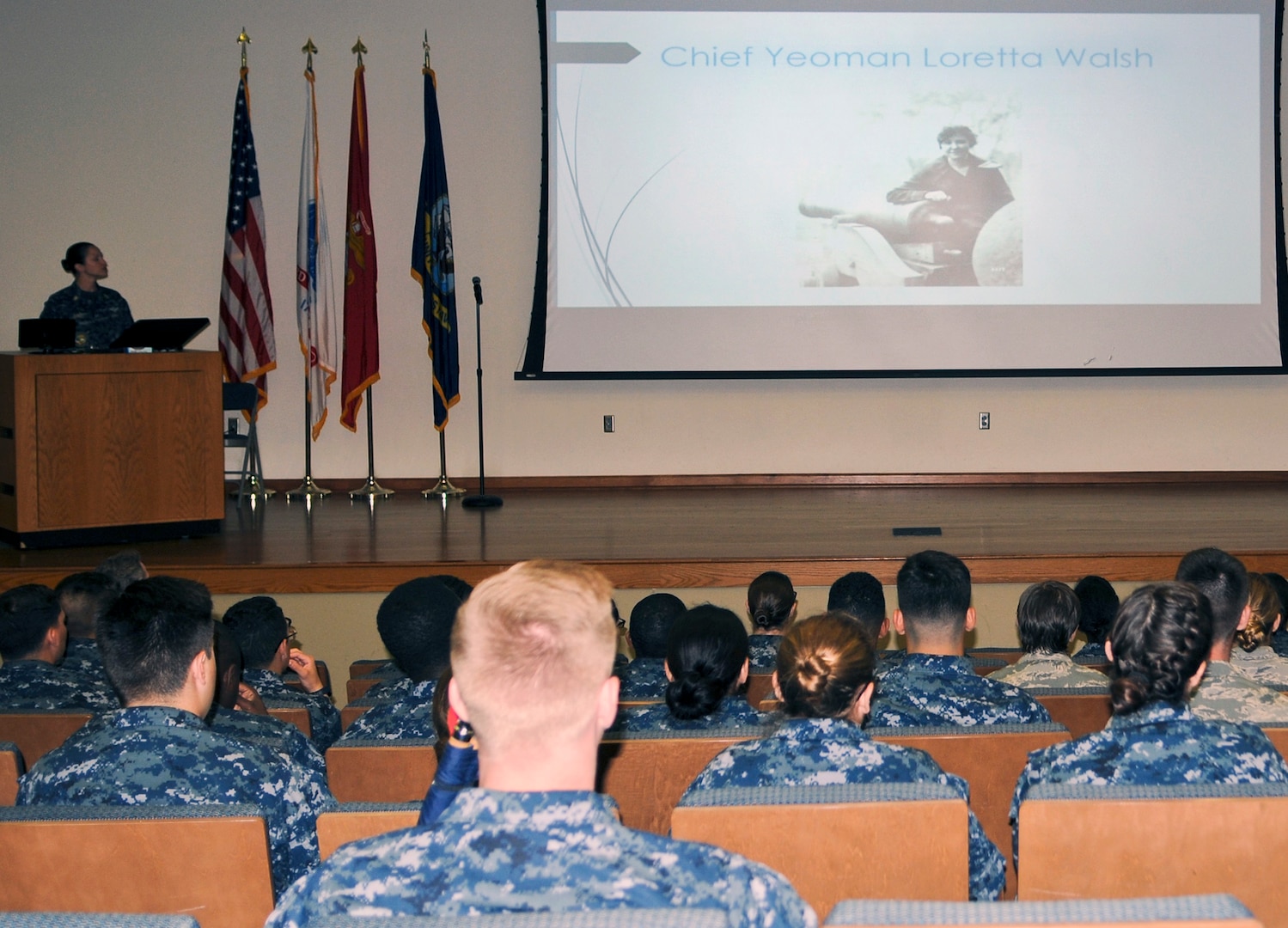 Petty Officer 1st Class Joy Lewis (left) a Hospital Corpsman “A” School instructor, speaks to staff and students at the Medical Education and Training Campus at Joint Base San Antonio-Fort Sam Houston during a Women’s History Month celebration March 28.