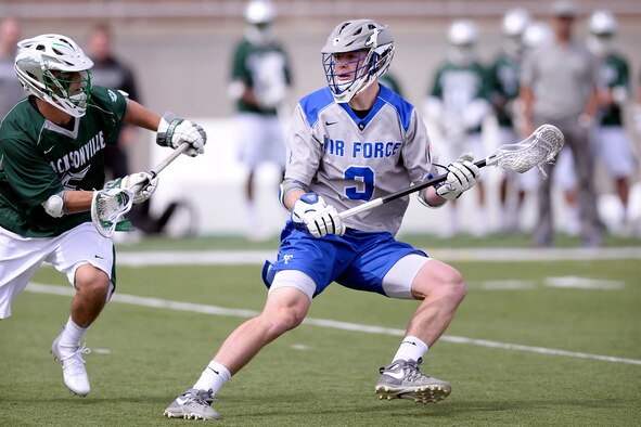 Trent Harper, a U.S. Air Force Academy sophomore, gains control of the ball as the Falcons met the Jacksonville University Dolphins in Falcon Stadium in Colorado Springs, Colo., March 25, 2017.  An overtime goal lifted the Falcons to a 10-9 win, as they improved to 6-3 overall with a 2-0 record in Southern Conference play. (Air Force photo/Mike Kaplan)