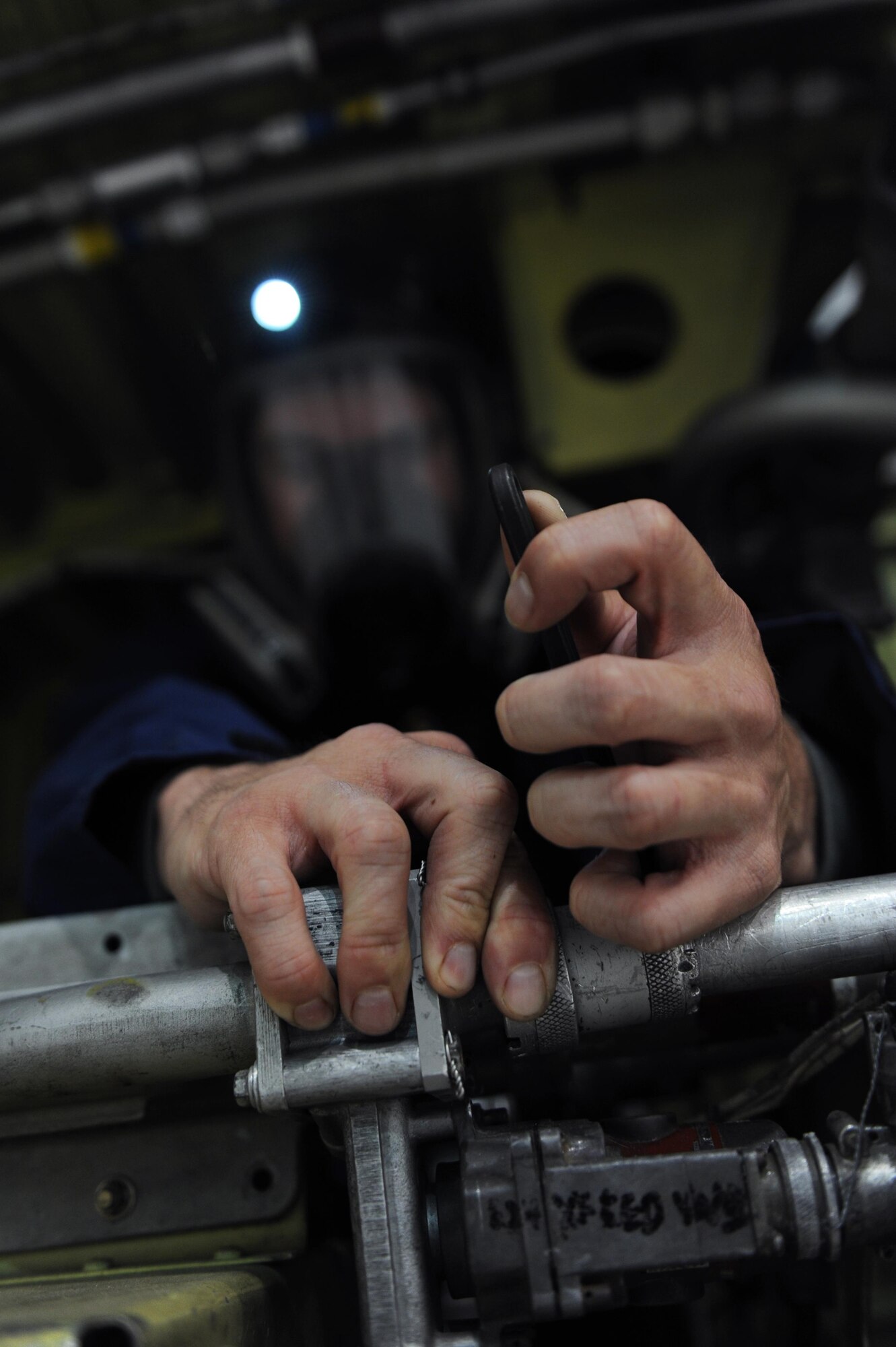 U.S. Air Force Senior Airman Timothy Thompson, 19th Maintenance Squadron Fuel Systems journeyman, takes apart a shutoff valve in a mock fuel tank March 29, 2017, at Little Rock Air Force Base, Ark.  Every tool must be accounted for and every step must be followed in a precise order.  (U.S. Air Force photo by Airman 1st Class Grace Nichols) 