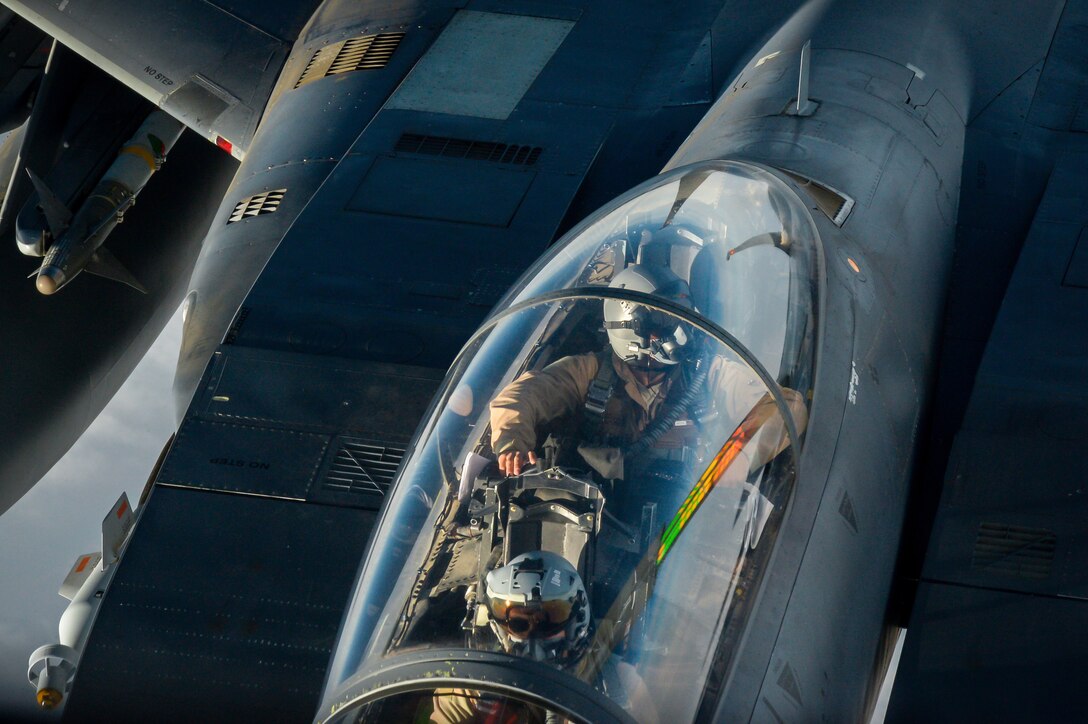 A F-15E Strike Eagle pilot approaches a KC-10 Extender from the 908th Expeditionary Air Refueling Squadron before conducting an aerial refuel during a Combined Joint Task Force - Operation Inherent Resolve mission March 20, 2017. The F-15E is a dual-role fighter designed to perform air-to-air and air-to-ground missions. (U.S. Air Force photo/Senior Airman Joshua A. Hoskins)