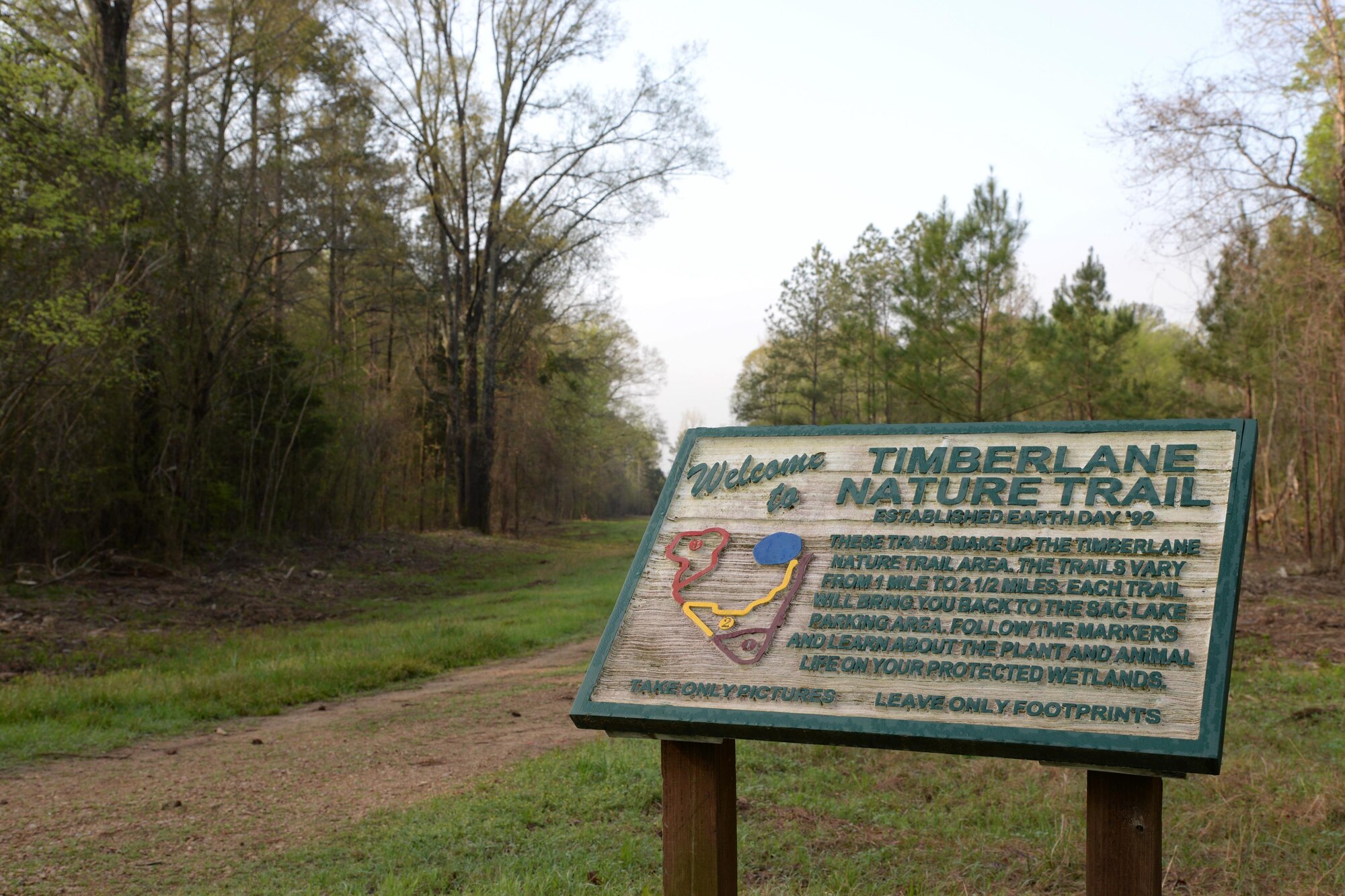 The Timberlane Nature Trail sign marks the start of Columbus Air Force Base’s nature trails, March 29, 2017, on Columbus Air Force Base, Mississippi. The trail is split into three separate trails that range between one to two and one-half miles long. 