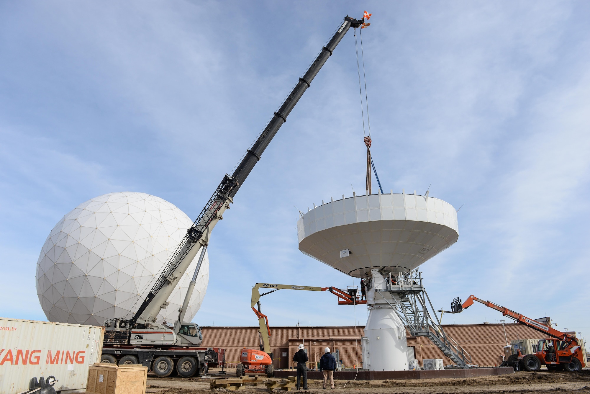 Technicians from the Tobyhanna Army Depot secure a communications dish to an Air Force Wideband Enterprise Terminal located at Offutt Air Force Base, Neb., Feb. 14, 2017. Air Force Wideband Enterprise Terminals located at Offutt Air Force Base, Neb. These terminals are among approximately 90 joint systems used worldwide to communicate and transfer information across the Global Information Grid. (U.S. Air Force photo by Zachary Hada)