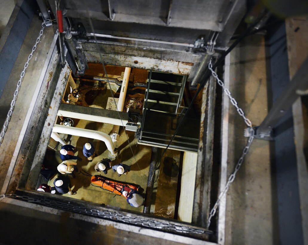 A group of Corps employees from various locks and dams throughout the Nashville District use a Tripod Rescue system to hoist 30 feet and simulate rescuing an injured worker from a permitted confined space at the Center Hill power plant during a permitted confined space training class March 16, 2017. 