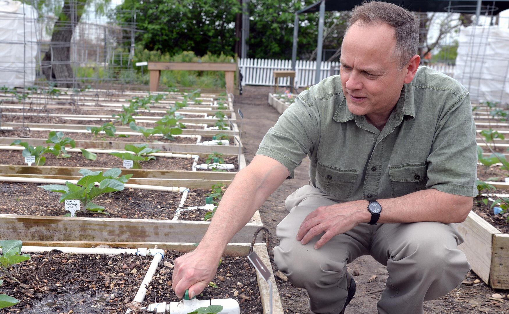 Bob Blaesing, a member of the U.S. Army Environmental Command, volunteers at the San Antonio Botanical Garden where he can enjoy the fresh air and help sow the seeds of gardening to schoolchildren who are learning to grow their own plants and appreciate nature.