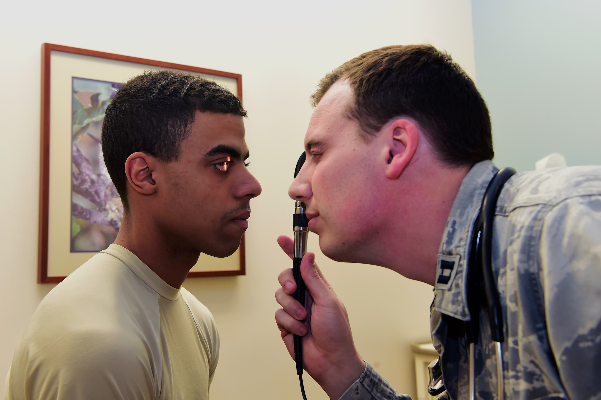 Capt. (Dr.) Ryan Frank, 460th Medical Group Doctor of Osteopath, performs an exam on Airman 1st Class Devante Wise, 460th MDG aerospace medical technician, March 30, 2017 at the Buckley Clinic in Aurora, Colo. Frank is part of the team of physicians at the 460th MDG who are being shown appreciation for National Doctor’s Day observed annually on March 30.
