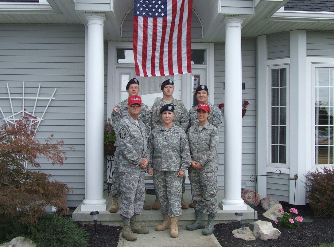 The Clemens family, with more than 120 years of collective military service, stands in front of the family home in Port Clinton, Ohio, after three of them returned from overseas deployments, March 17, 2005. Photo courtesy of the Clemens family
