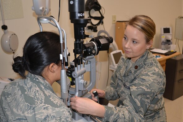 Maj. Kara Reynolds, 477th Aerospace Medicine Flight Chief of Optometry, participates in training activities with Senior Airman Andrea Jaque-Baez during the unit training assembly at Joint Base Elmendorf-Richardson, Alaska Mar. 4-5, 2017. (U.S. Air Force photo by Staff Sgt. Mike Campbell)