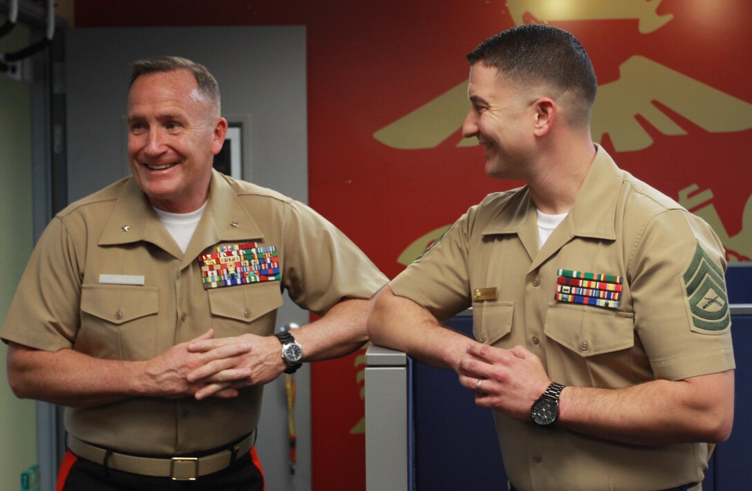 Brigadier Gen. William M. Jurney, commanding general for Western Recruiting Region, Marine Corps Recruit Depot San Diego, speaks to Gunnery Sgt. Christopher Gonzales, staff non-commissioned officer in charge of Marine Corps Recruiting Substation Santa Ana, during a command visit, March 29, 2017. Recruiting Station Orange is one of eight regional recruiting stations located across the Western U.S., to include Alaska and the Pacific islands.