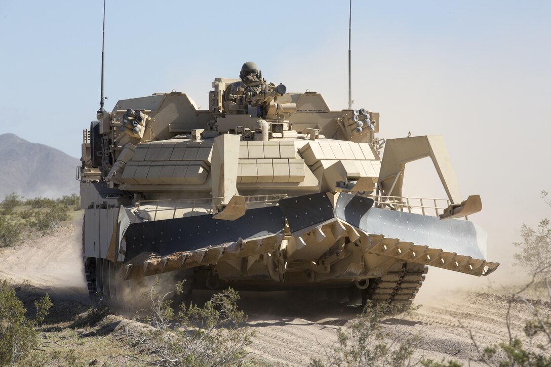 An Assault Breacher Vehicle crosses in onto Marine Corps Air Ground Combat Center, Twentynine Palms, during Exercise Desert March, March 27, 2017. He exercise was made to test the battalion’s capabilities in handling a long distance movement as well as test the battalion’s capabilities of logistically supporting the battalion throughout the exercise. (U.S. Marine Corps photo by Cpl. Thomas Mudd)