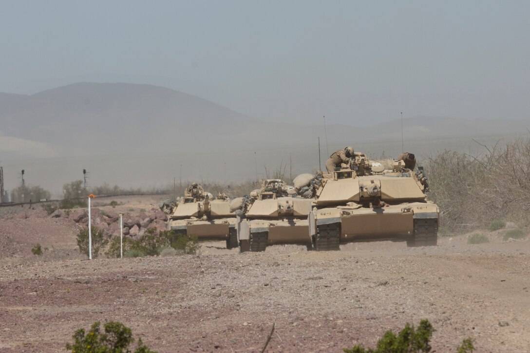 Marines of 1st Tank Battalion conduct an inspection of their vehicles on their way to Marine Corps Air Ground Combat Center, Twentynine Palms, Calif., during Exercise Desert March, March 27, 2017. He exercise was made to test the battalion’s capabilities in handling a long distance movement as well as test the battalion’s capabilities of logistically supporting the battalion throughout the exercise. (U.S. Marine Corps photo by Cpl. Thomas Mudd)