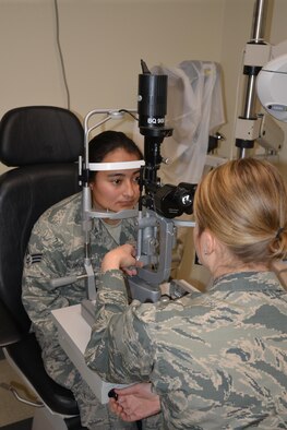 Maj. Kara Reynolds, 477th Aerospace Medicine Flight Chief of Optometry, participates in training activities with Senior Airman Andrea Jaque-Baez during the unit training assembly at Joint Base Elmendorf-Richardson, Alaska Mar. 4-5, 2017. (U.S. Air Force photo by Staff Sgt. Mike Campbell)