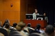 U.S. Air Force Col. Jill Scheckel, 55th Medical Group commander, talks about gymnast Nadia Comăneci, a Romanian gymnast, at the Women’s History Month speaking engagement hosted by the Offutt Diversity Team at the 557th Weather Wing’s Chief Master Sgt. Peter Morris Auditorium, March 24, 2017, Offutt Air Force Base, Neb. Scheckel was one of four speakers at the event.