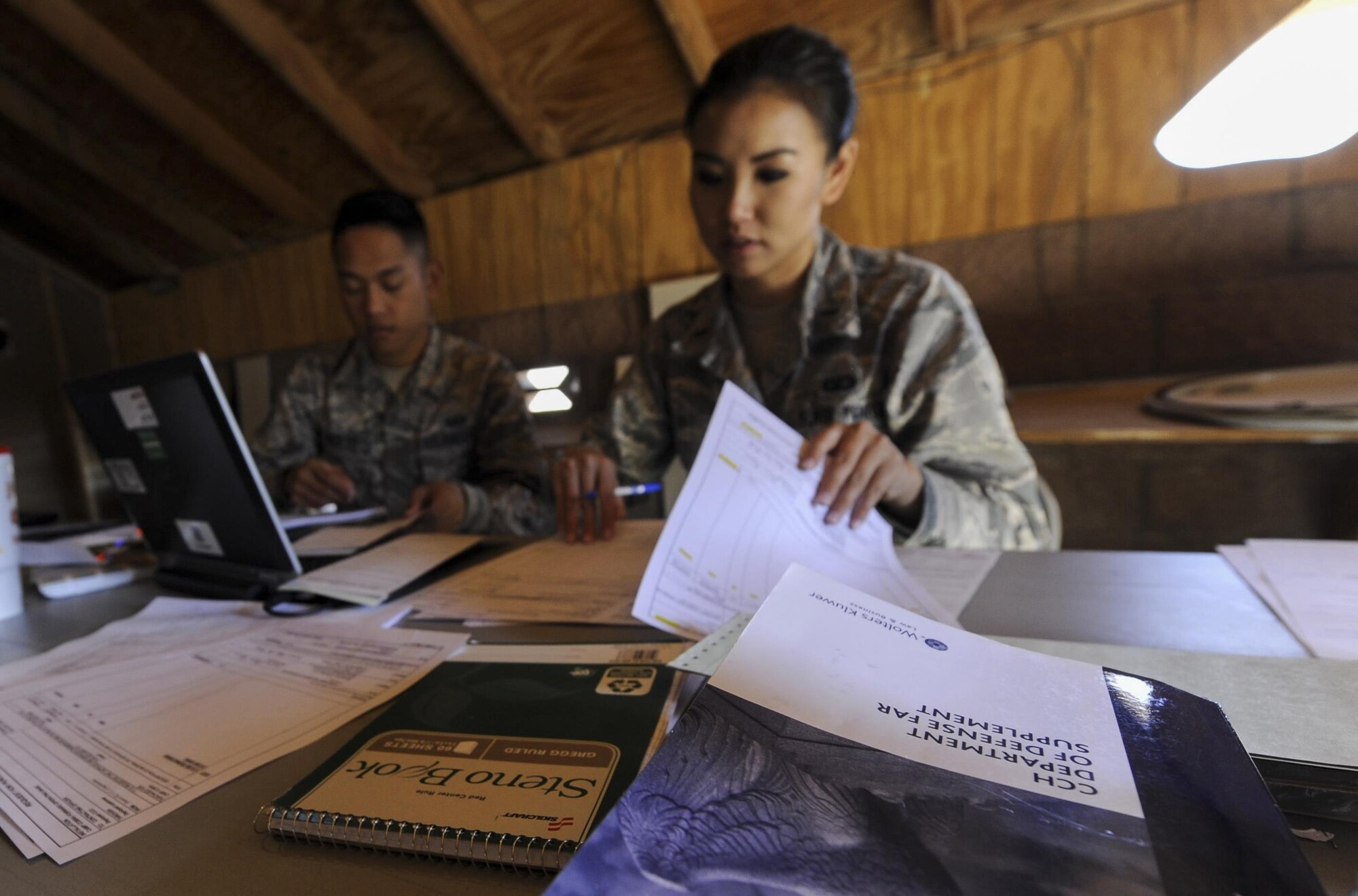 U.S. Air Force contracting officers evaluate offers during a training exercise organized by the 99th Contracting Squadron on Nellis Air Force Base, Nev., March 16, 2017. This exercise exposed Airmen form multiple bases to contingency contracting and some of the challenges they may encounter in a bare base environment. (U.S. Air Force photo by Airman 1st Class Kevin Tanenbaum/Released)