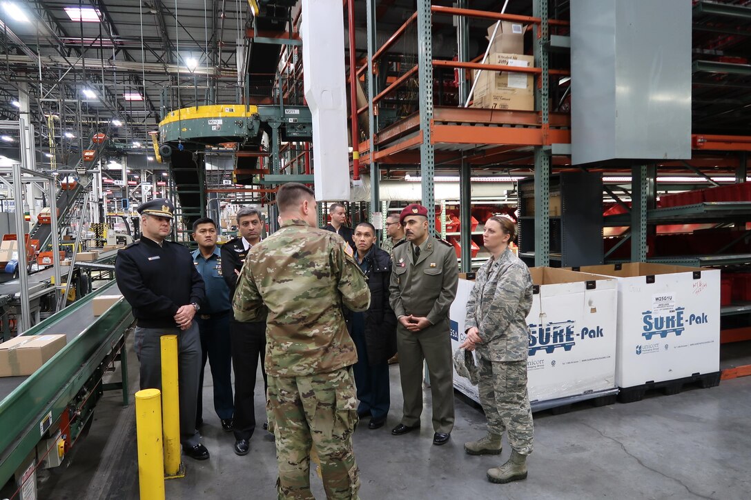 Students from the Navy Supply Corps School’s International Leadership Executive Advanced Development course tour DLA Distribution Susquehanna, Pennsylvania’s Eastern Distribution Center after discussing the organization’s mission capabilities.    