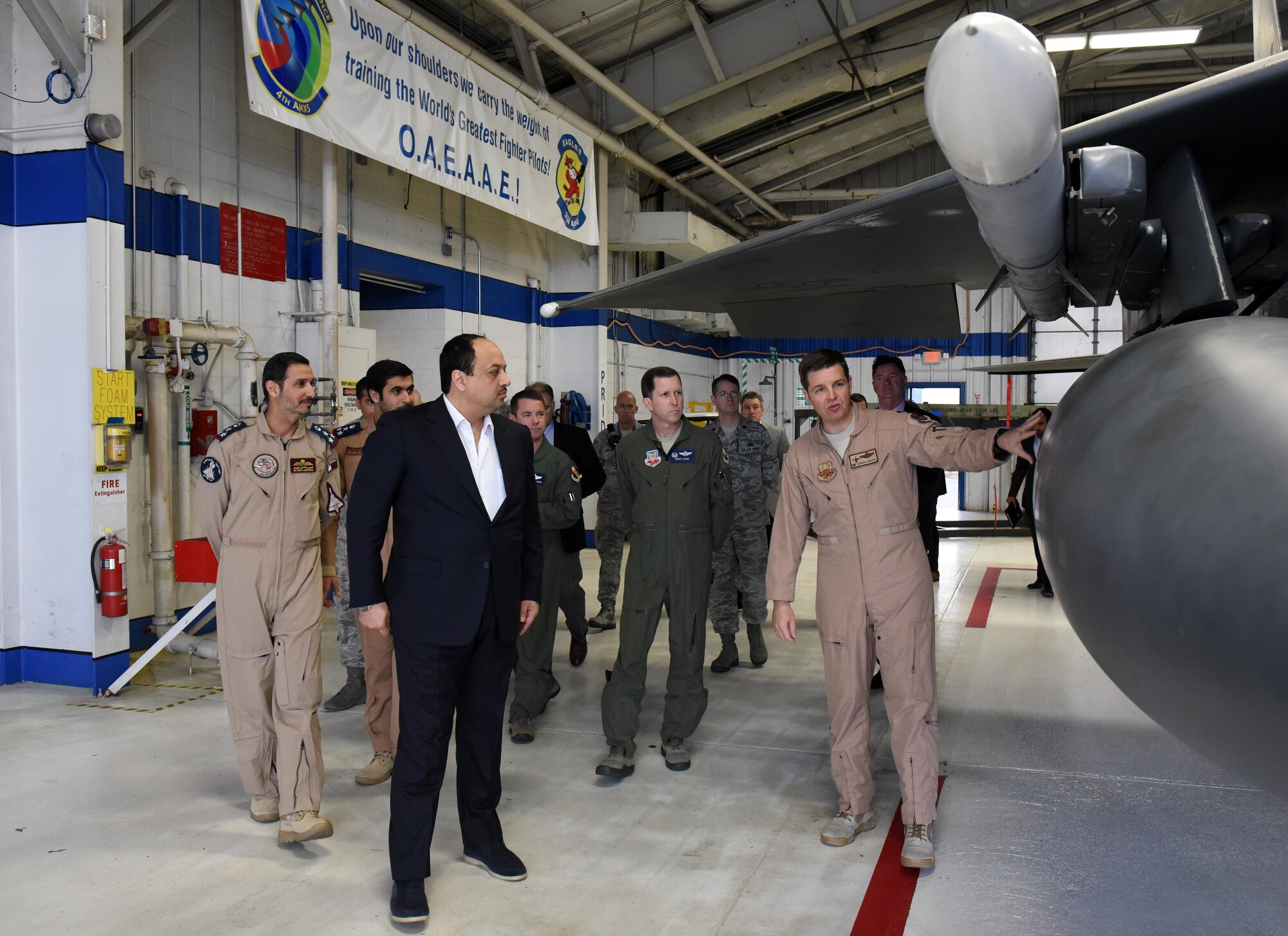 Lt. Col. Dave Haworth (right), Office of Military Cooperation at the U.S. Embassy in Qatar, showcases the F-15E Strike Eagle to his Excellency Khalid Mohammad Al Attiyah, Qatar's Minister of State for Defense Affairs, March 28, 2017, at Seymour Johnson Air Force Base, North Carolina. After a base tour, his Excellency flew in the backseat of an F-15E to experience the aircraft’s capabilities firsthand. (U.S. Air Force photo by Airman 1st Class Kenneth Boyton)