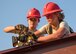 Senior Airman Paige Rodgers and Staff Sgt. Keny Drescher-Brown, 823rd Red Horse Squadron structures Airmen, drill a beam into place March 23 during a construction project at Eglin Air Force Base, Fla. The 96th Civil Engineer Group’s open air pavilion is one of many troop training projects the 823rd RHS will complete for the Department of Defense, the Air Force and the local community to maintain their skills until the next deployment. (U.S. Air Force photo/Ilka Cole)