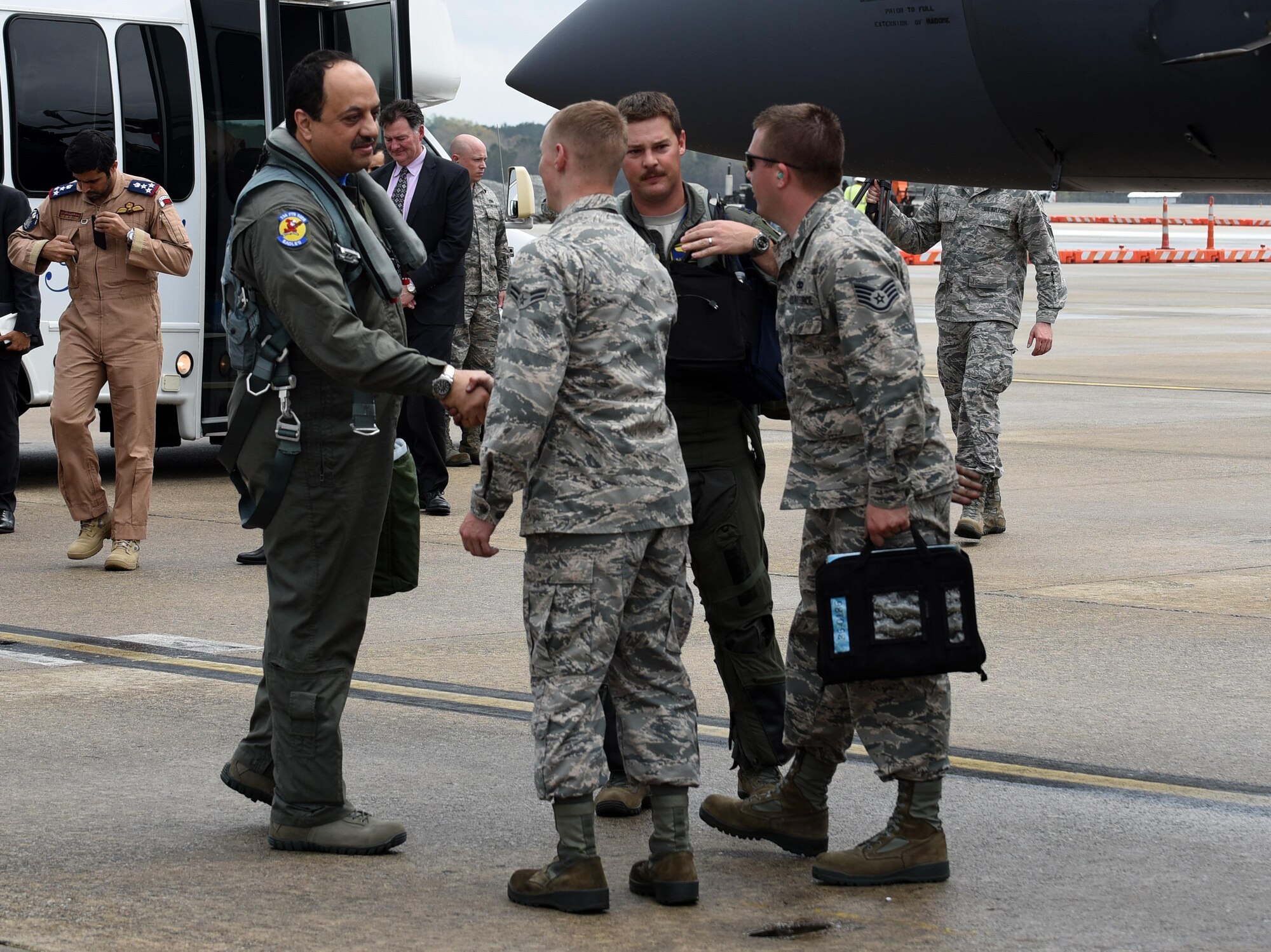 His Excellency Khalid Mohammad Al Attiyah (left), Qatar's Minister of State for Defense Affairs, shakes hands with Airman 1st Class Adam Frey, 4th Aircraft Maintenance Squadron crew chief, March 28, 2017, at Seymour Johnson Air Force Base, North Carolina. Frey prepared the F-15E Strike Eagle for his Excellency’s first flight in the aircraft. (U.S. Air Force photo by Airman 1st Class Kenneth Boyton)