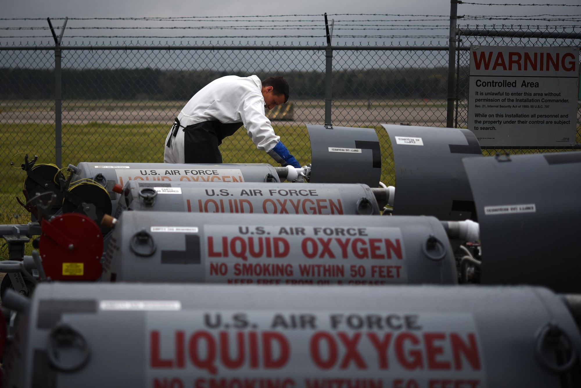 U.S. Air Force Senior Airman Richard Hayes, 19th Logistics Readiness Squadron fuel cryogenics journeyman, opens a vent valve to release excess pressure within liquid oxygen carts March 27, 2017, at Little Rock Air Force Base, Ark. Cryogenic Airmen fill and maintain containers with liquid oxygen to provide fresh air to pilots in flight. (U.S. Air Force photo by Airman 1st Class Kevin Sommer Giron)