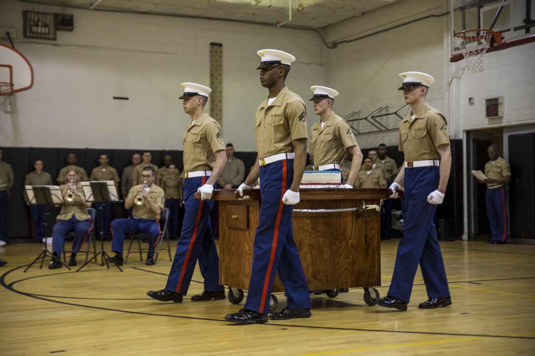 Marines with Marine Barracks Washington D.C., march in with ceremonial cake during the MBW birthday ceremony at Marine Barracks Washington, D.C., March 31, 2017. Marine Barracks Washington, D.C., also known as "8th & I," is the oldest active post in the Marine Corps. It was founded by President Thomas Jefferson and Lt. Col. William Ward Burrows, the second commandant of the Marine Corps, in 1801. Each year the Marines of MBW celebrate the establishment of the “Oldest Post of the Corps” and will continue with this tradition for many years to come. (U.S. Marine Corps photo by Lance Cpl. Damon A. Mclean/Released)