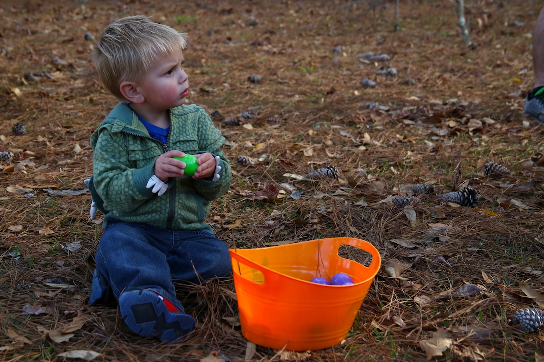 A child counts his eggs after participating in an egg hunt at the annual Pig Pickin’, sponsored by the Havelock Military Affairs Committee at Marine Corps Air Station Cherry Point, March 30, 2017. More than 200 people, including Marines with Marine Attack Training Squadron 203, Marine Aircraft Group 14, 2nd Marine Aircraft Wing, family members and members of the Havelock community attended the event. The Havelock MAC started the Pig Pickin’ tradition in 1992 as a way to show community support of service members on the air station, increase unit morale, and reconnect Marines with their families. (U.S. Marine Corps photo by Cpl. Mackenzie Gibson/ Released)