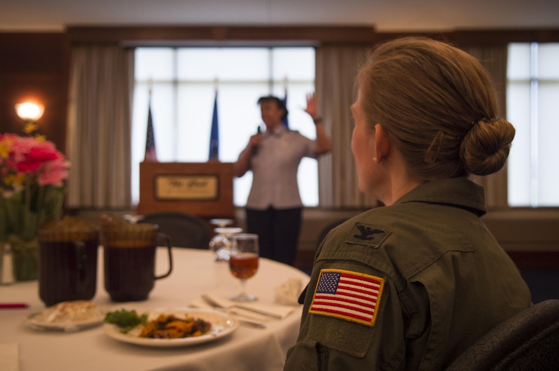 Col. Julie Grundahl, 11th Wing and Joint Base Andrews vice commander, listens to Lt. Gen. Stayce Harris, assistant vice chief of staff, Headquarters U.S. Air Force, Washington, D.C., speak at Joint Base Andrews, Md., for Women’s History Month, March 31, 2017. Harris, the highest ranking African American woman in the Air Force, spoke about the importance of Women’s History Month and recognizing gender bias.(U.S. Air Force photo by Senior Airman Mariah Haddenham)