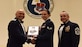 Col. Jimmy Canlas, left, 437th Airlift Wing commander, and Chief Master Sgt. Kristopher Berg, right, 437th AW command chief, congratulate Senior Airman Andrea Jansen 16th Airlift Squadron loadmaster, for earning the John L. Levitow Award during the class 17-C Airman Leadership School Graduation ceremony March 30, 2017, at Joint Base Charleston, South Carolina. The Levitow Award is the highest honor awarded to an ALS graduate and is given to the Airman who displays the highest level of leadership qualities. ALS is a five-week course encompassing lessons in the principles of supervision and management, the importance of communication and military professionalism. 