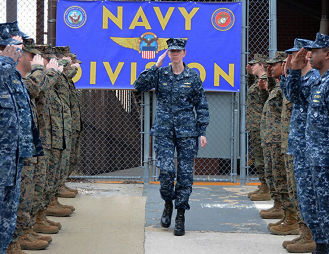 Defense Logistics Agency Aviation’s Navy Lt. Traci Irby, center, weapon system support program manager for the F/A-18, Navy Customer Facing Division farewells teammates, Mar. 3, 2017, in a piping ashore ceremony held on Defense Supply Center Richmond, Virginia. In an awards ceremony held Mar. 10, 2017, Irby received an exceptional meritorious service award for her performance during a 4-month assignment to Fleet Readiness South West at San Diego, California. Her performance on assignment led to implementing Deputy Materiel Management Chief military positions to be placed at each of the FRC sites.