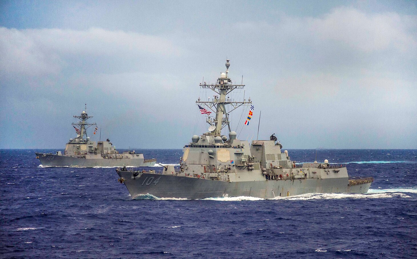 File photo:  The guided-missile destroyers USS Sterett (DDG 104), front, and USS Dewey (DDG 105) maneuver into formation during the conclusion of Valiant Shield 2014. Valiant Shield is a U.S.-only exercise integrating U.S. Navy, Air Force, Army, and Marine Corps assets, offering real-world joint operational experience to develop capabilities that provide a full range of options to defend U.S. interests and those of its allies and partners. 